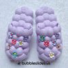 Diseño de flor púrpura Bubble Slides